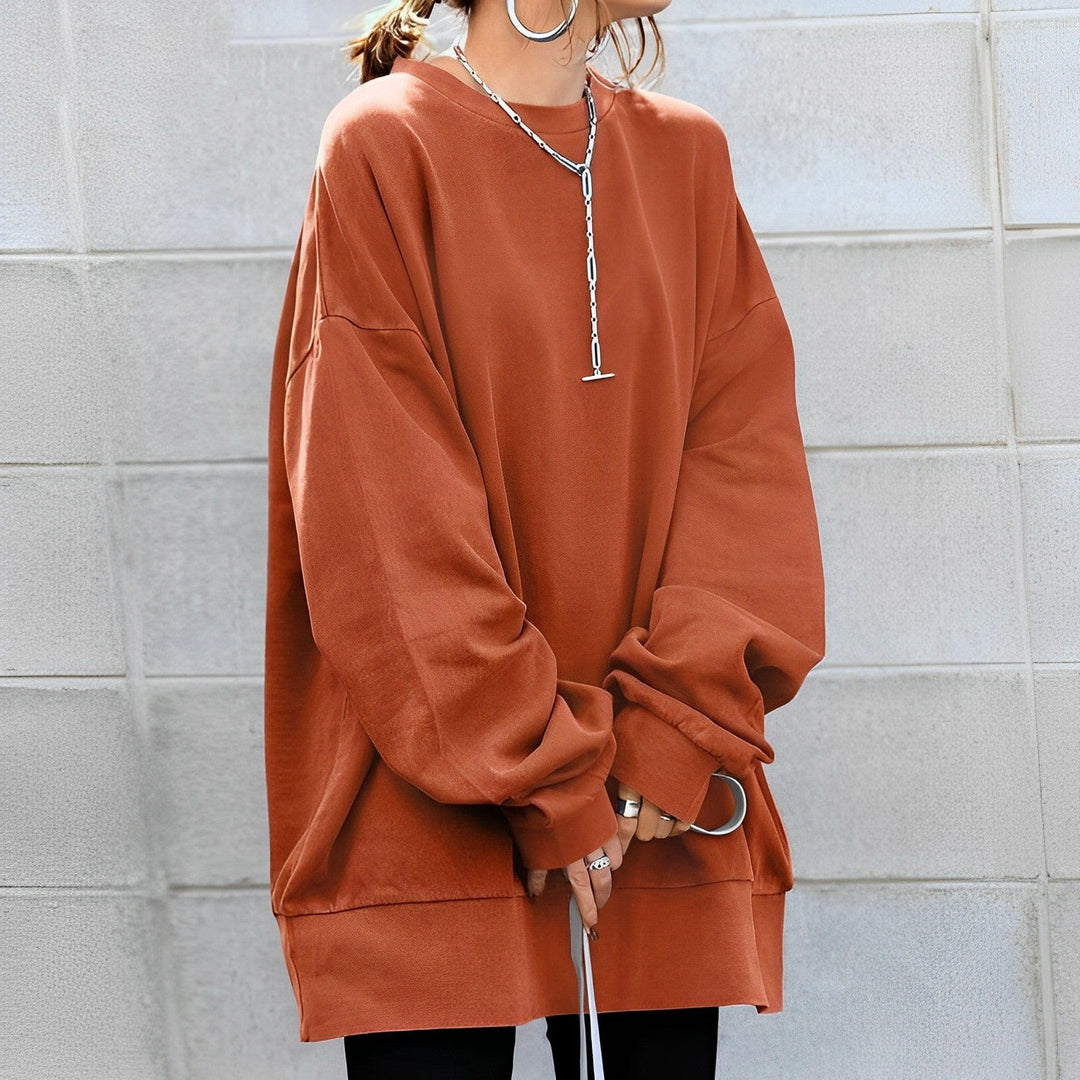 Comfortable women's apparel: long sleeve oversized sweatshirt with dropped shoulders, great for relaxed style.