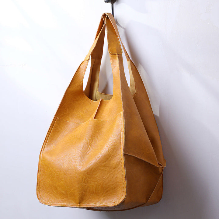 Fashionable yellow oversized women's shoulder bag. A functional large tote, great for daily errands.