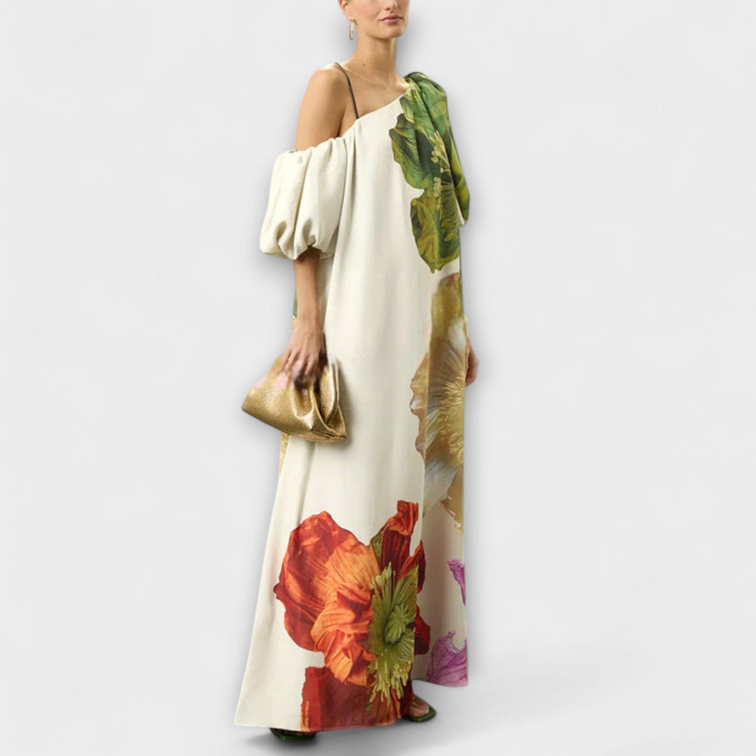 Artistic print oversized floral maxi dress for women. Features elegant off-shoulder neckline & dramatic puff sleeves.