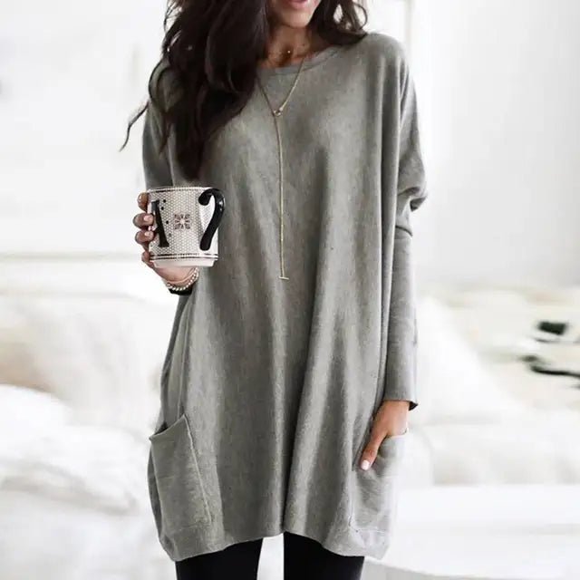 Casual women's long sleeve tunic top with practical pockets, relaxed fit style for everyday fashion.