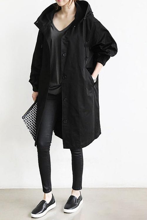 Stylish women's oversized rain trench coat, perfect water-resistant outerwear for casual layering.