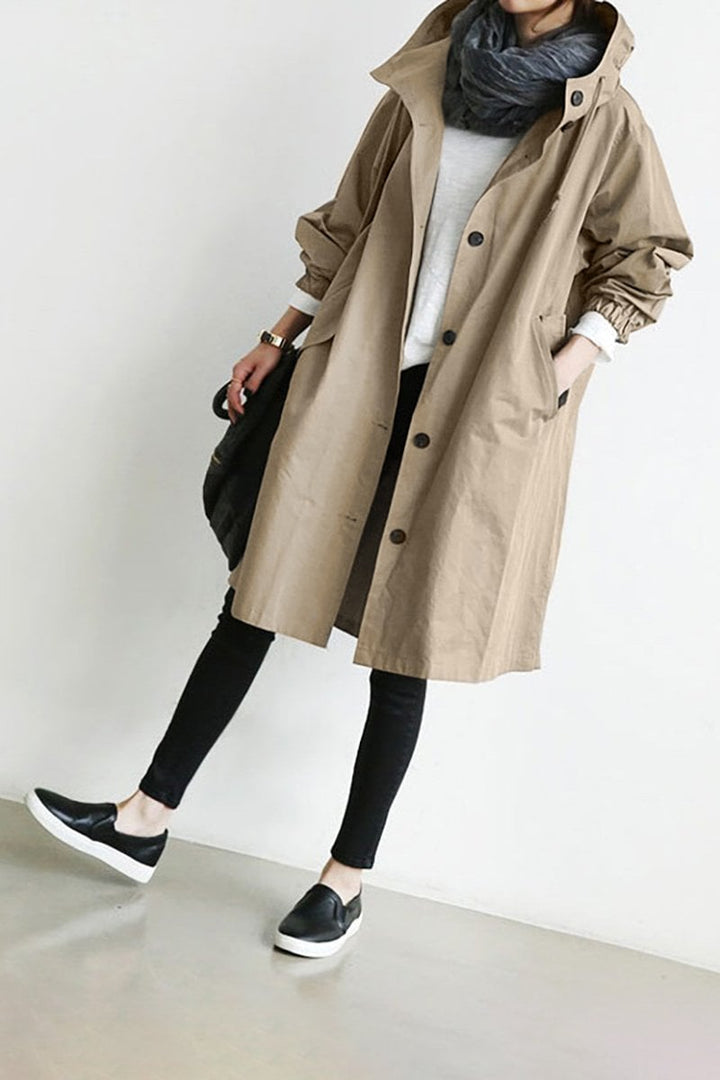 Casual women's oversized rain trench coat. Water-resistant parka, stylish outerwear for spring/fall.