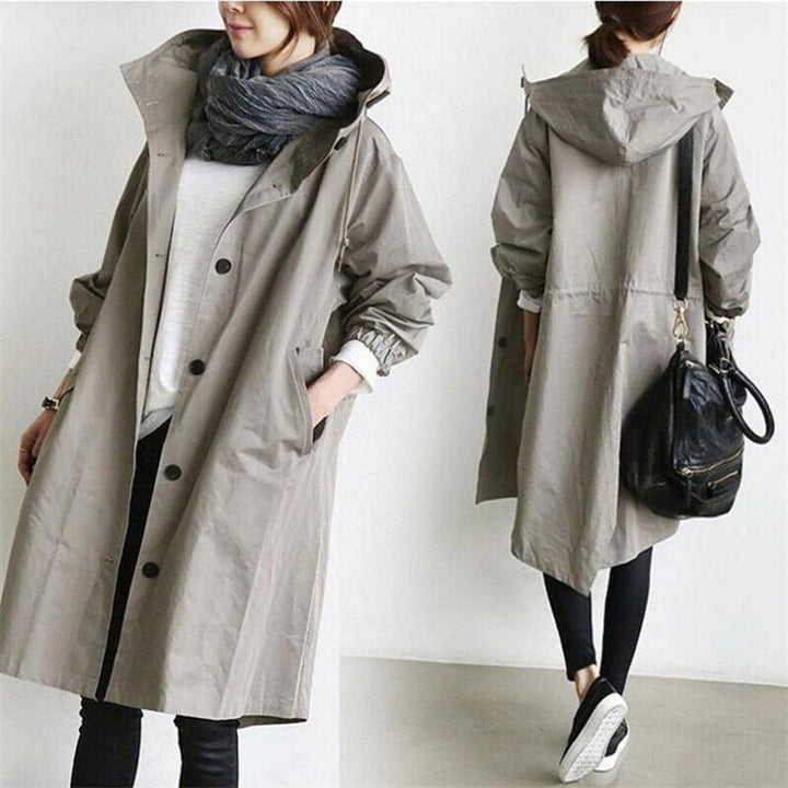 Modern women's oversized rain coat. Water-resistant trench parka, ideal for spring/fall layering & chic style.