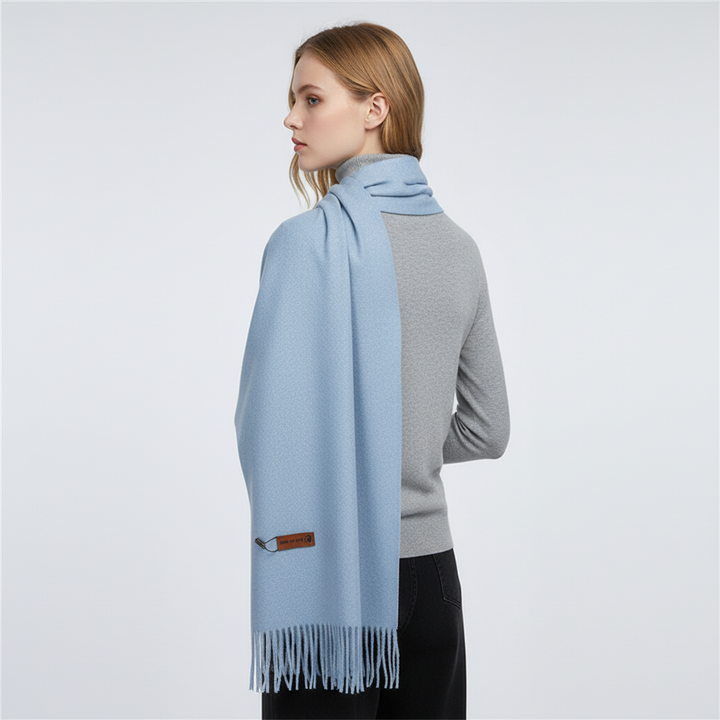 Luxurious women's winter accessory: an oversized, soft, and warm scarf for elegant cold-weather style.