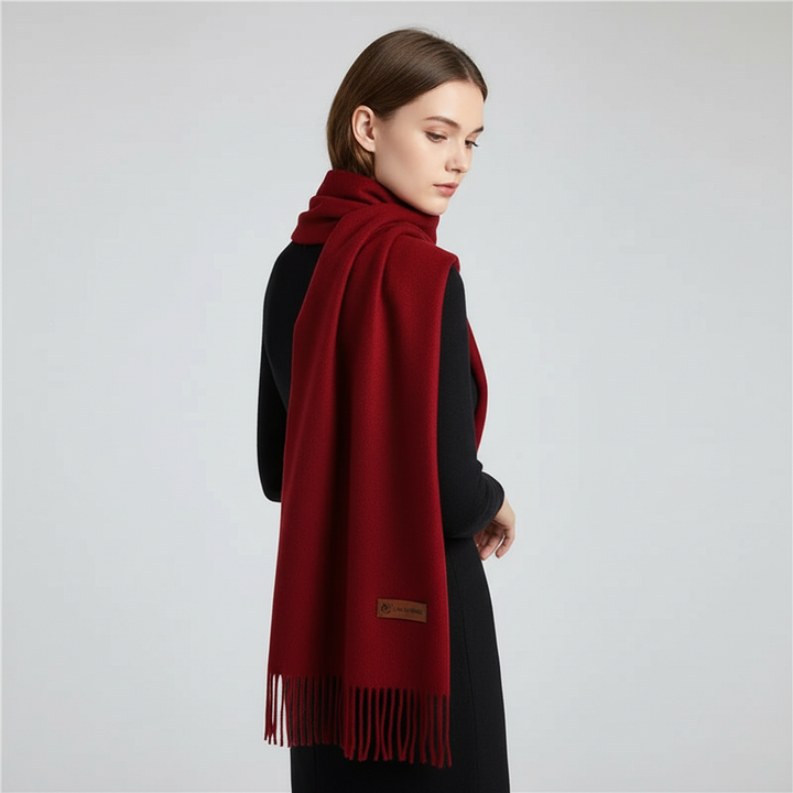 Elegant women's oversized warm winter scarf, featuring a classic solid color and delicate fringe.