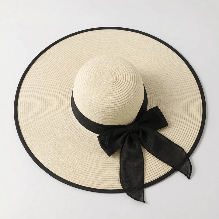 Fashionable women's wide brim sun hat, perfect for beach, pool, travel, or any sunny summer day.