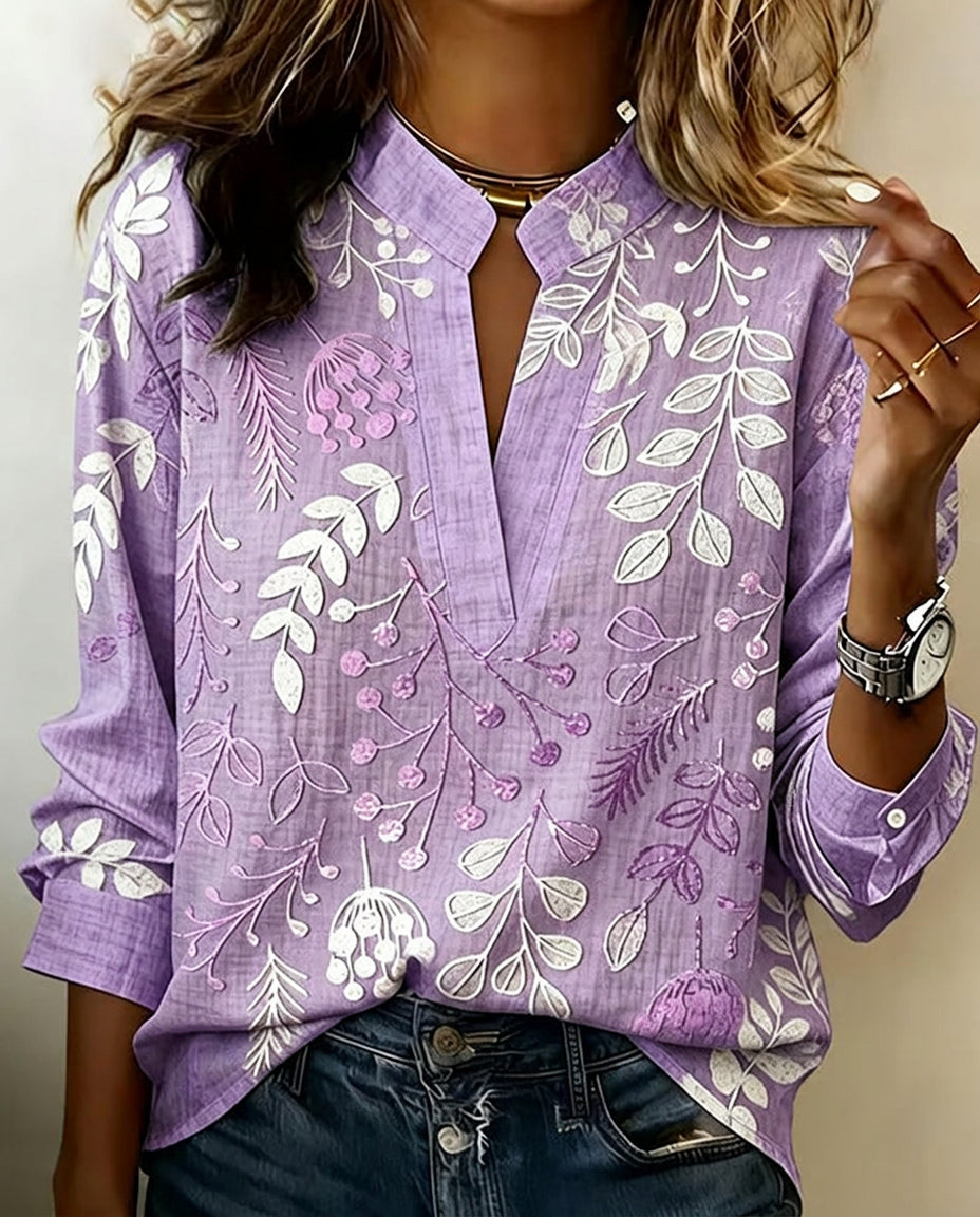 Women's pastel floral v-neck blouse, relaxed fit, perfect for spring & summer fashion.