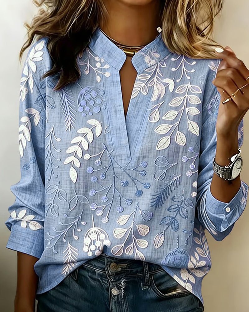 Elegant pink pastel floral v-neck women's blouse, relaxed fit for summer fashion.