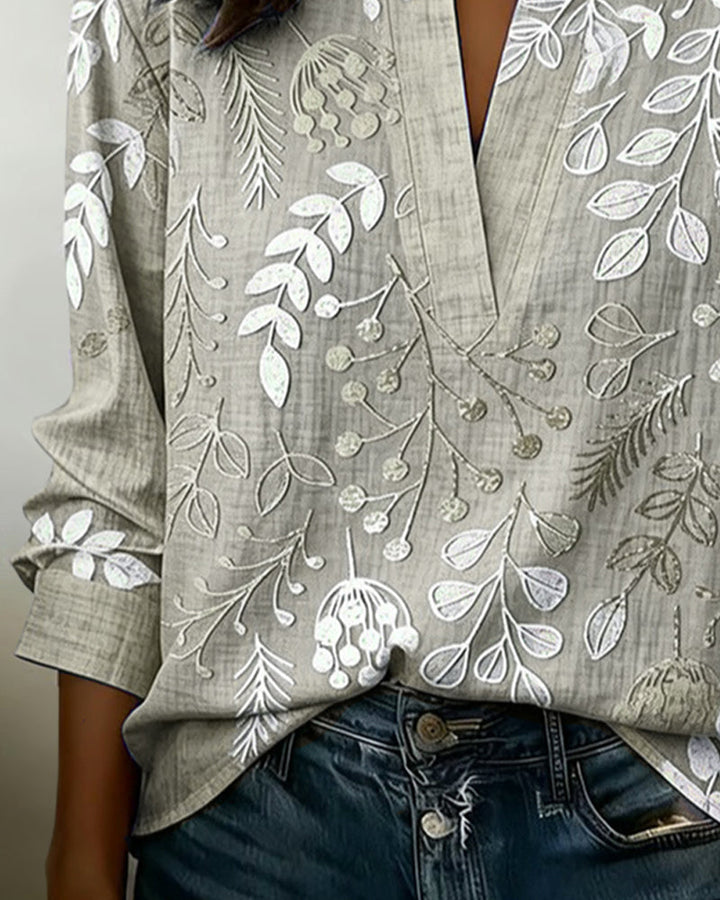Breezy pastel floral v-neck women's blouse, a must-have for summer fashion trends.