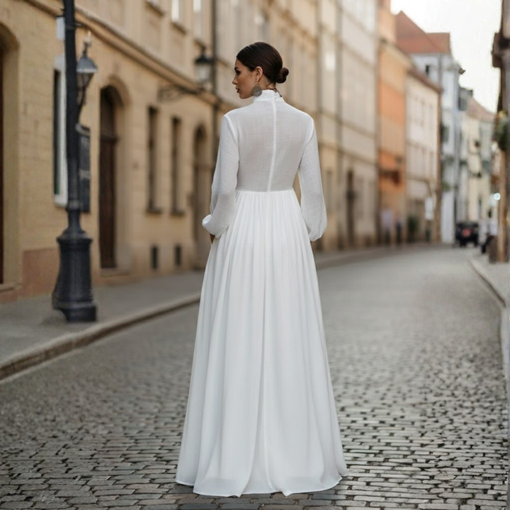 Modest women's long sleeve maxi dress with a unique patchwork design & high neckline, ideal for fall/spring wear.