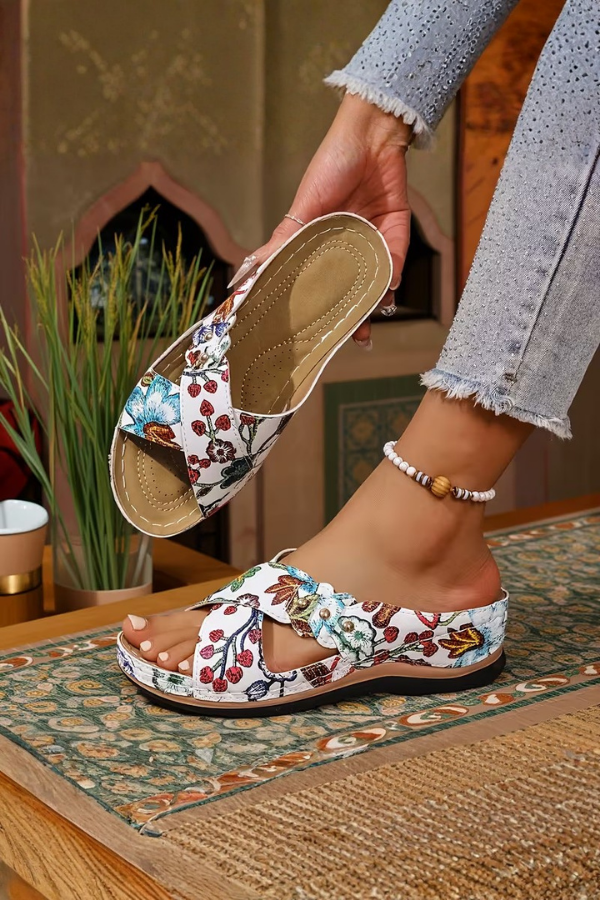 Women's perforated wedge slip-on sandals, ideal for summer comfort & style.