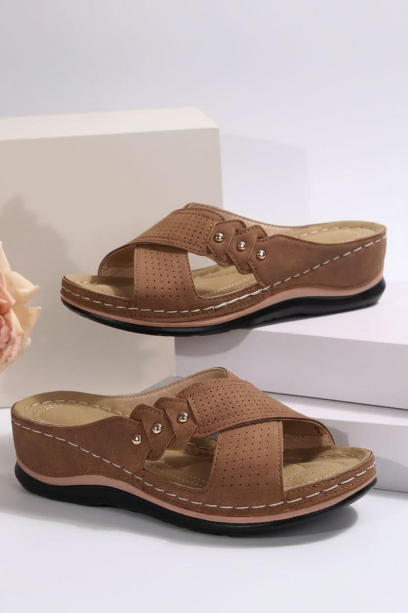 Women's comfort slip-on wedge sandals, perforated for breathability, stylish lightweight summer footwear.