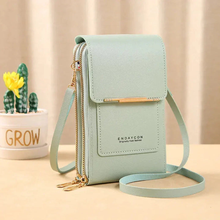 Modern women's accessory: compact crossbody phone bag with easy touchscreen access and storage.