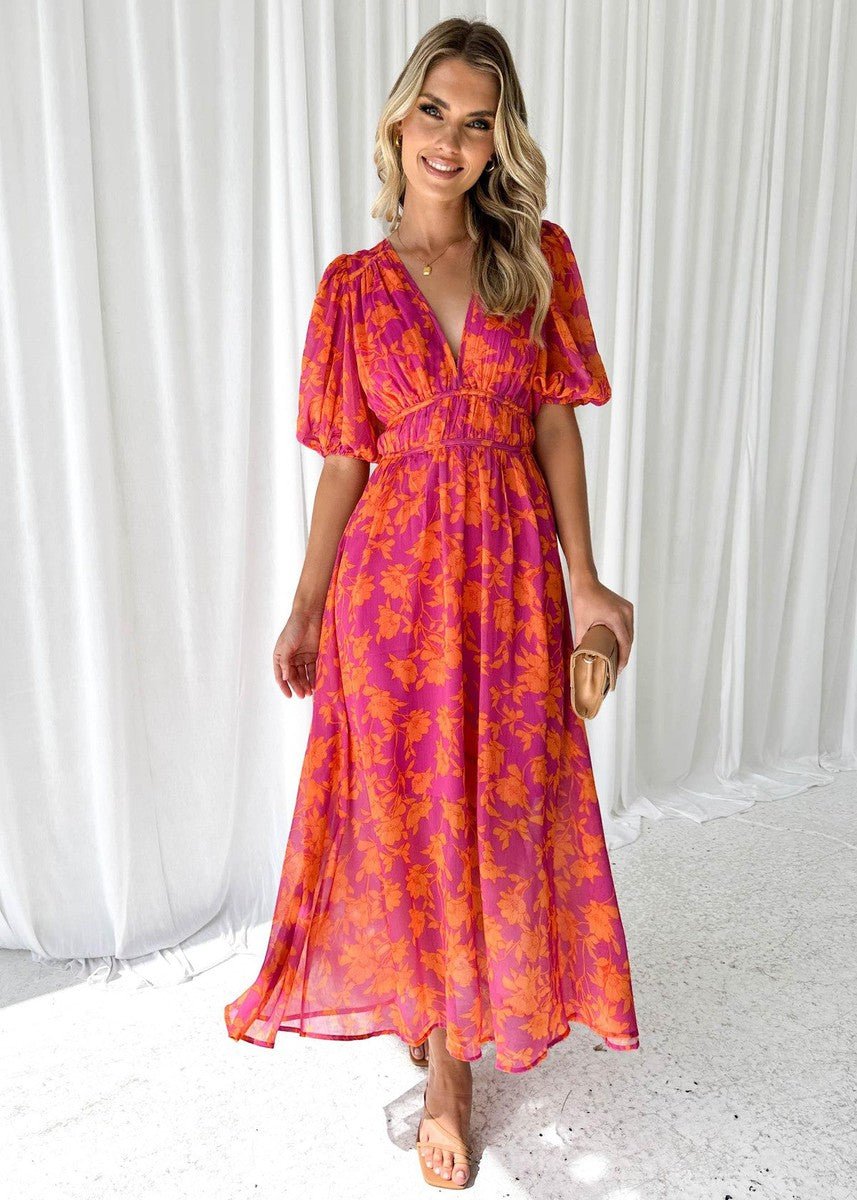 Stylish women's pink orange floral maxi dress featuring a V-neck, puff short sleeves, great for summer & vacation.