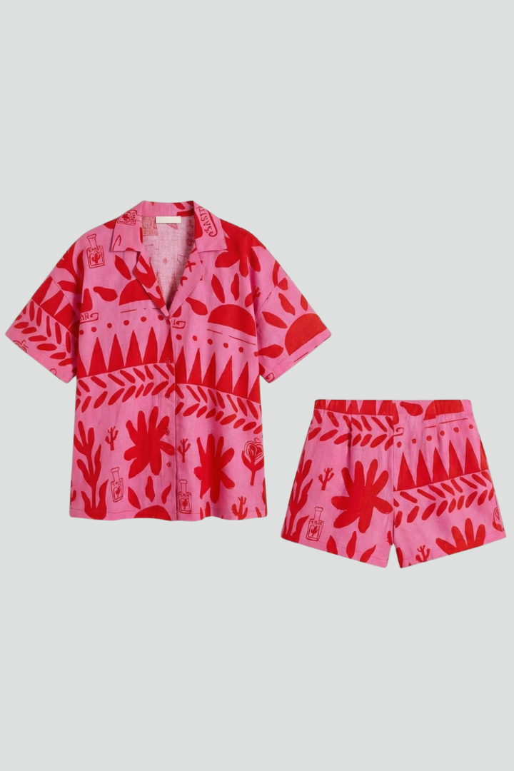Women's pink tropical print camp collar shirt & shorts co-ord set. Stylish resort wear for summer vacations & beach.