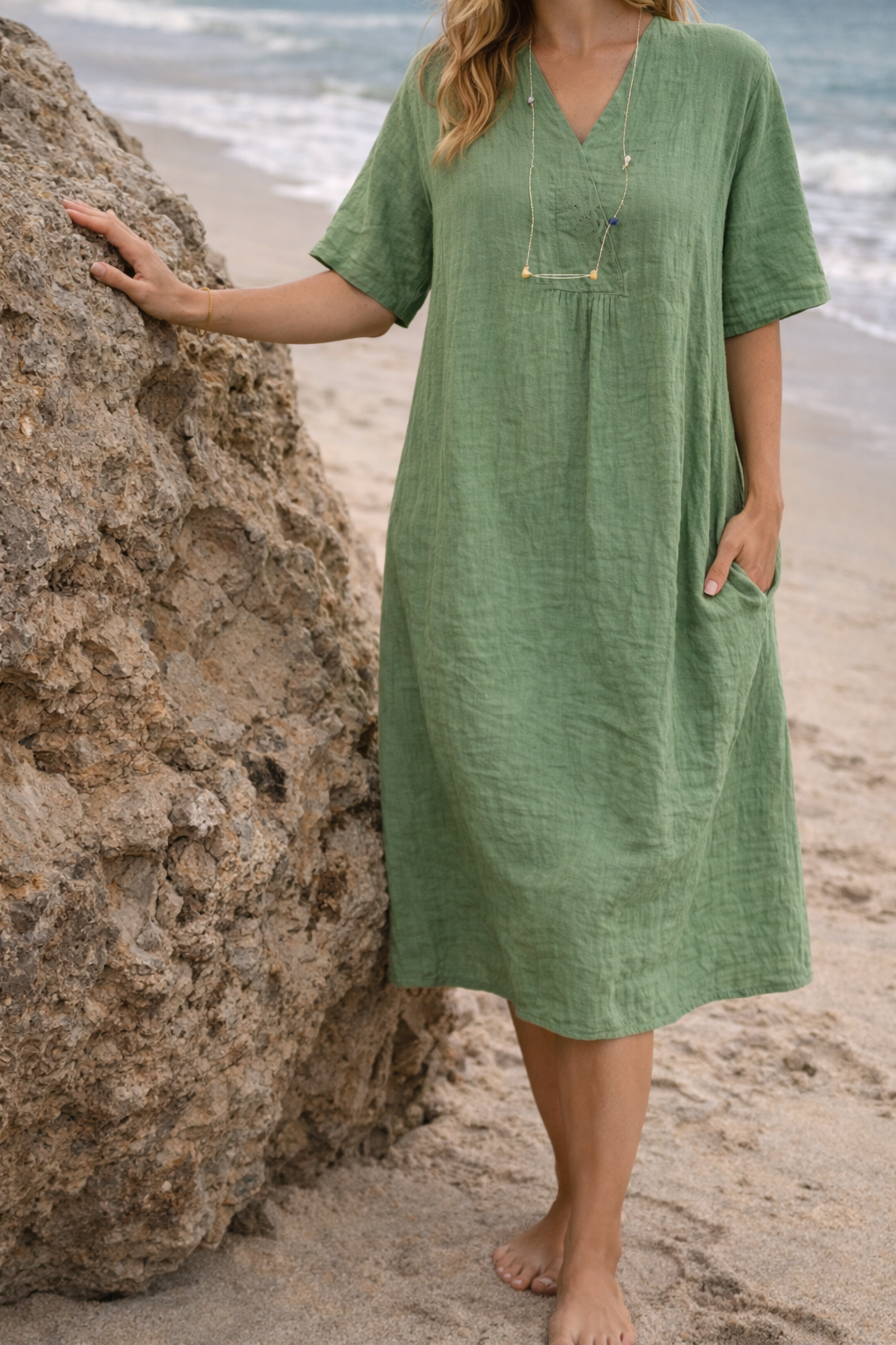 Elegant dark green V-neck midi dress for women, featuring a loose fit and short sleeves, perfect for day wear.