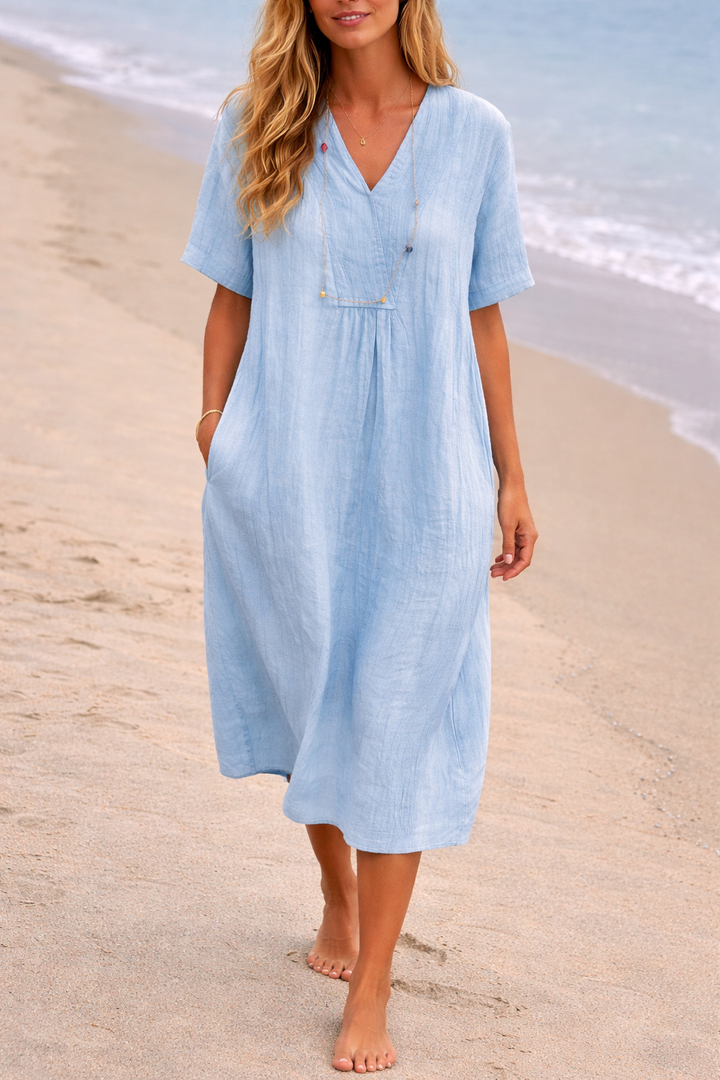 Comfortable blue V-neck loose fit midi dress for women, short-sleeved, ideal for casual summer and day wear.