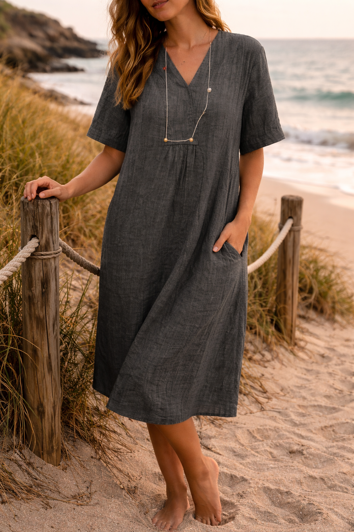 Stylish green V-neck loose fit midi day dress for women, short sleeve, offering comfort for casual wear.