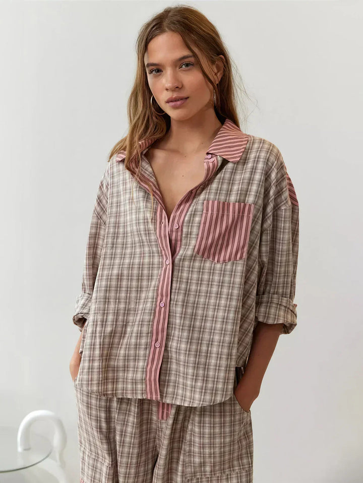 Women's plaid pajama set with a button-up shirt and relaxed fit pants, ideal for cozy sleepwear and loungewear.