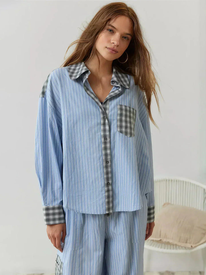 Classic red and black plaid women's pajama set featuring a button-front shirt and elastic waist sleep pants.