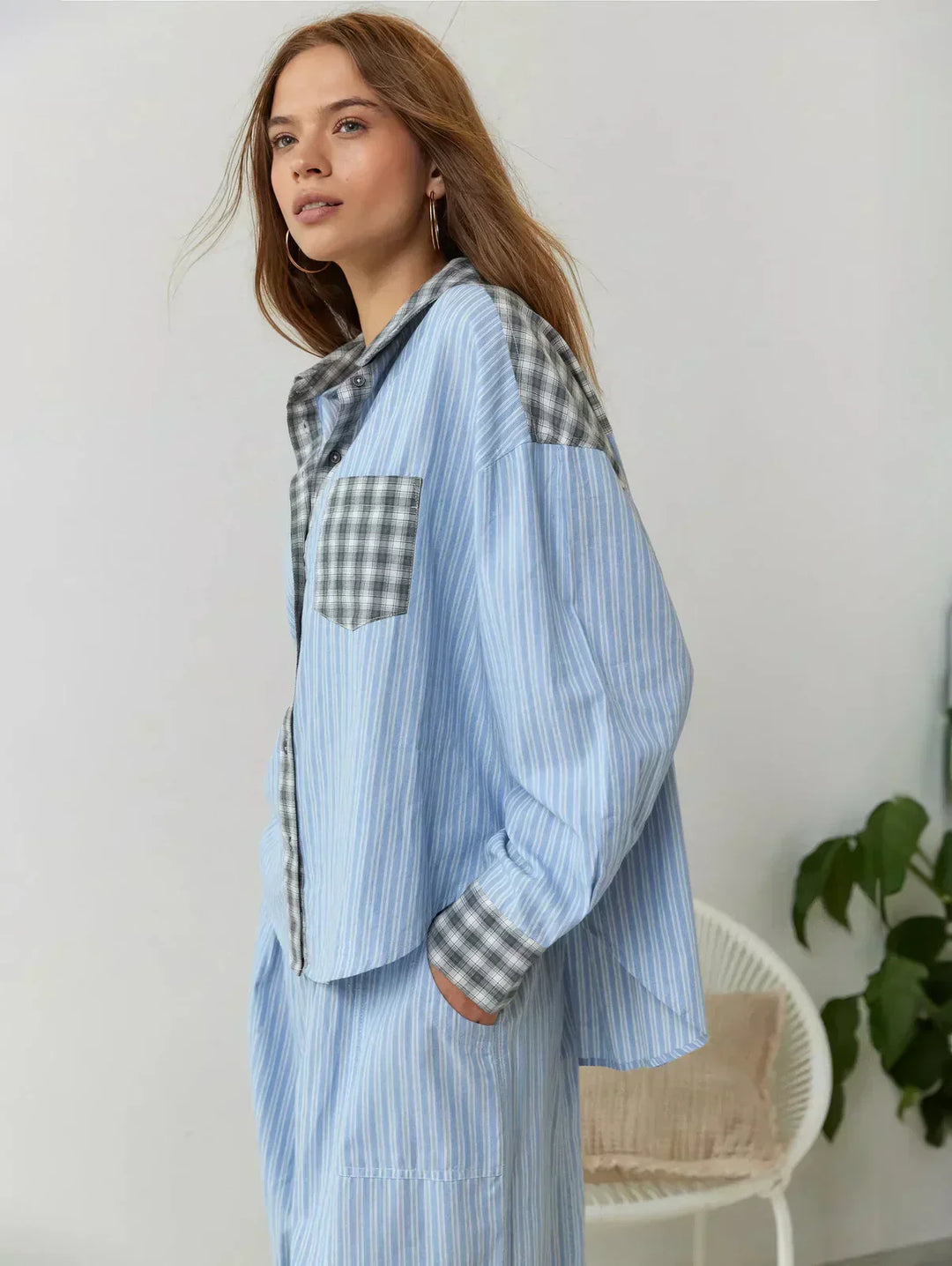 Detail of the soft, breathable fabric of the women's plaid pajama set, highlighting its cozy feel and relaxed fit.