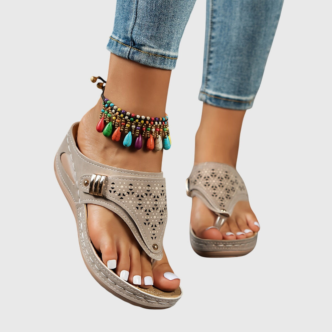 Perforated design women's platform sandals with an ankle strap, open toe, and chunky heel for summer.