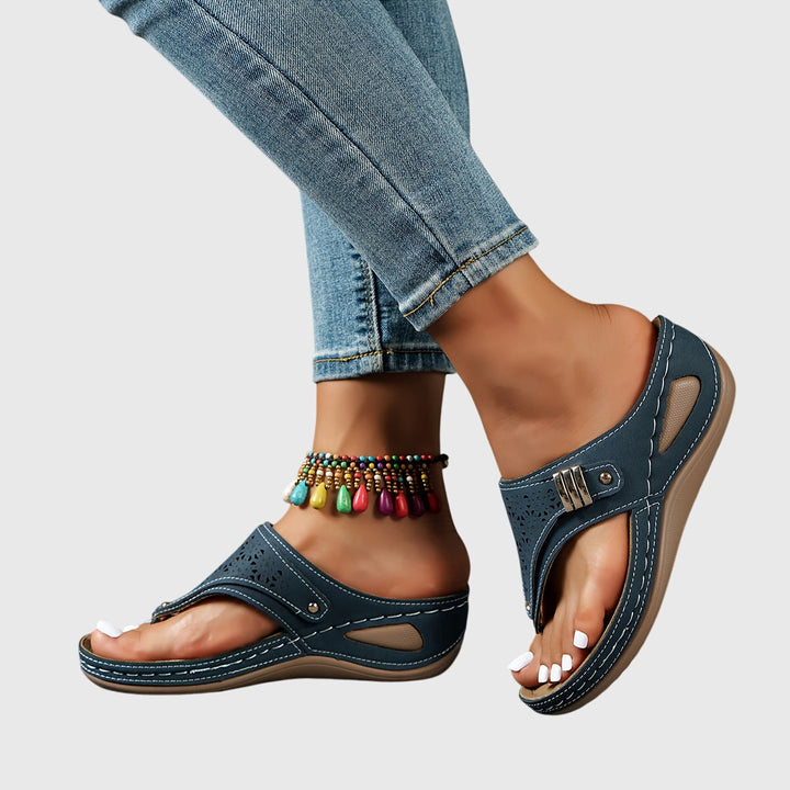 Fashionable women's open-toe platform sandals with chunky heel, ankle strap, and perforated details.