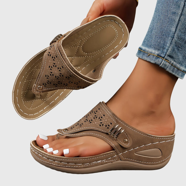 Perfect summer women's platform sandals with an ankle strap, open toe, and elegant perforated design.