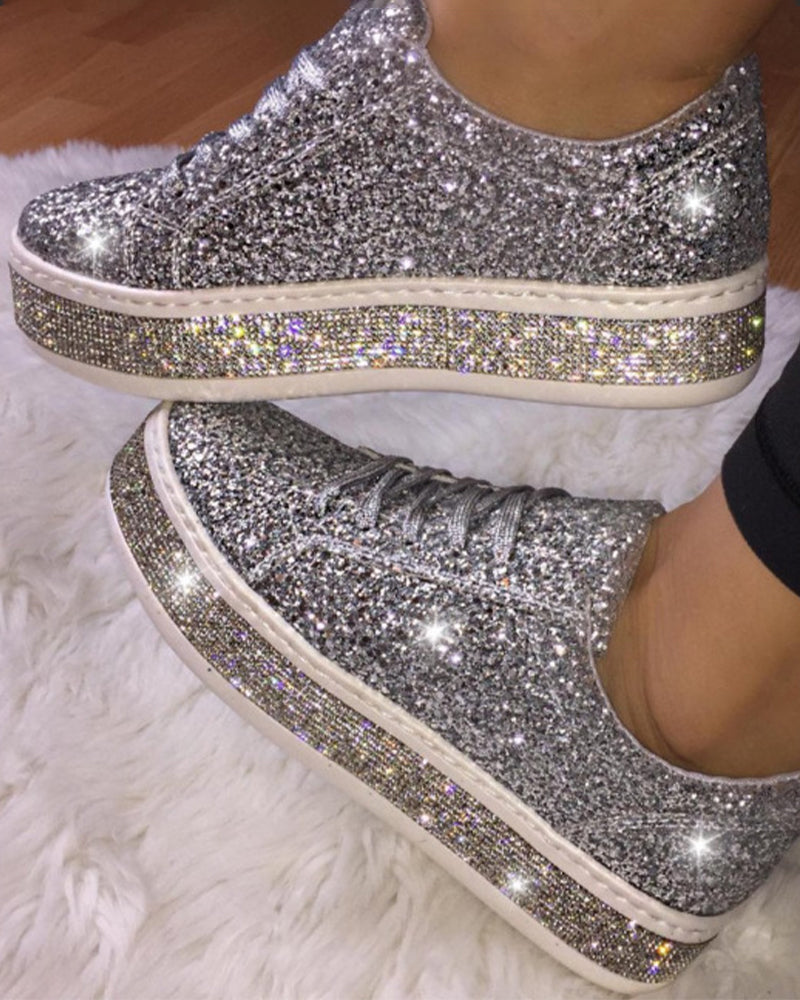 Women's platform glitter sneakers, perfect for chic everyday wear. Sparkle & comfort.