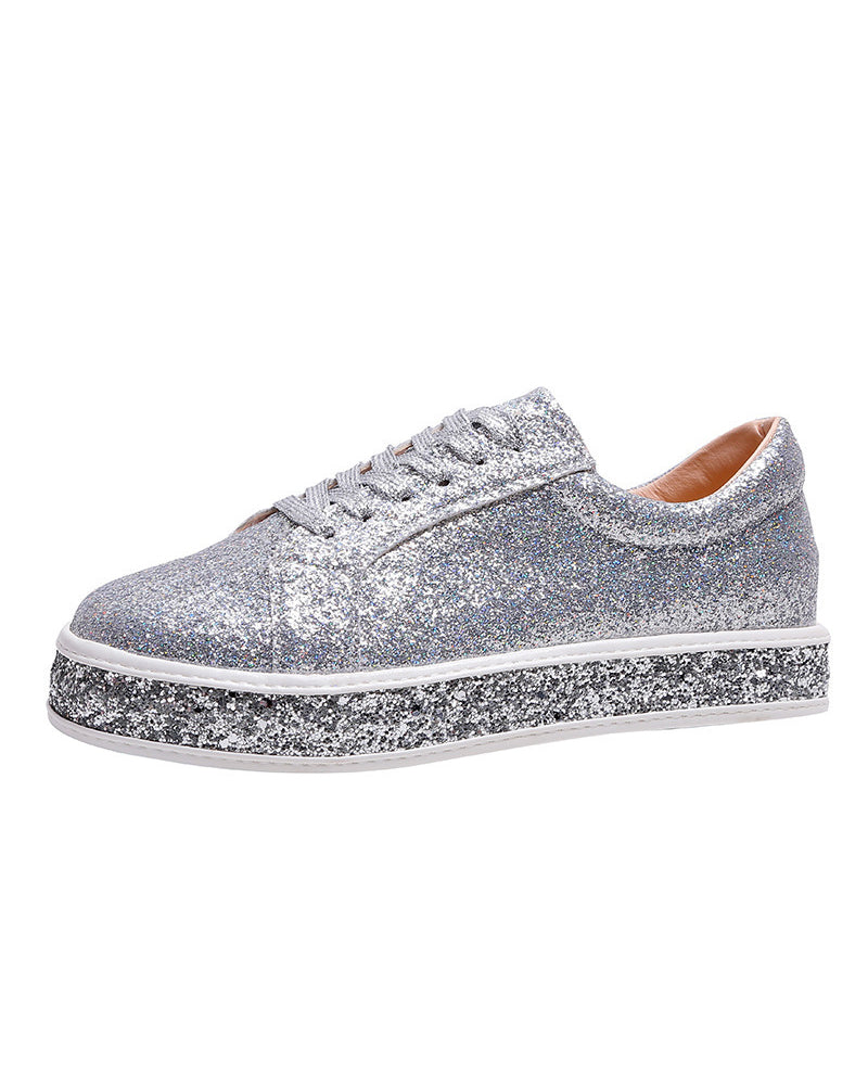 Detail of women's platform glitter sneakers, highlighting comfortable design & trendy platform.