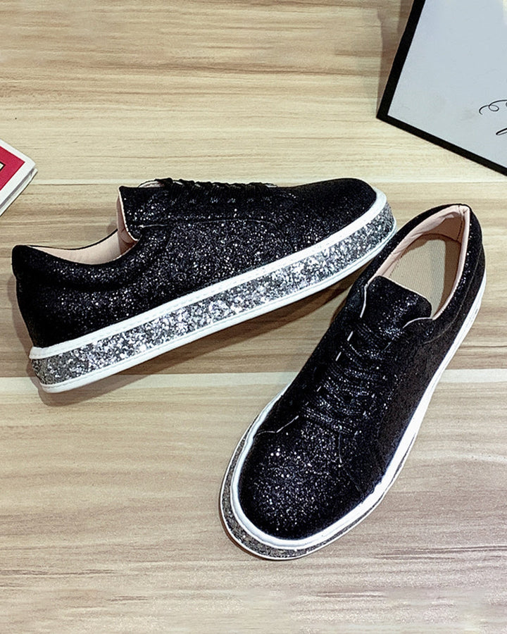 Dazzling glitter on women's platform sneakers, adding sparkle to any casual outfit.