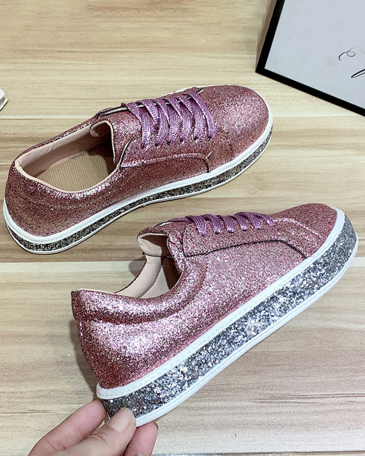 Chic women's platform glitter sneakers, blending fashion footwear with comfort.