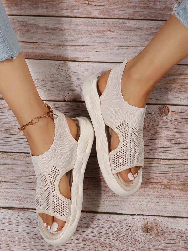 Stylish women's platform slip-on sandals, open toe design for casual summer outings.