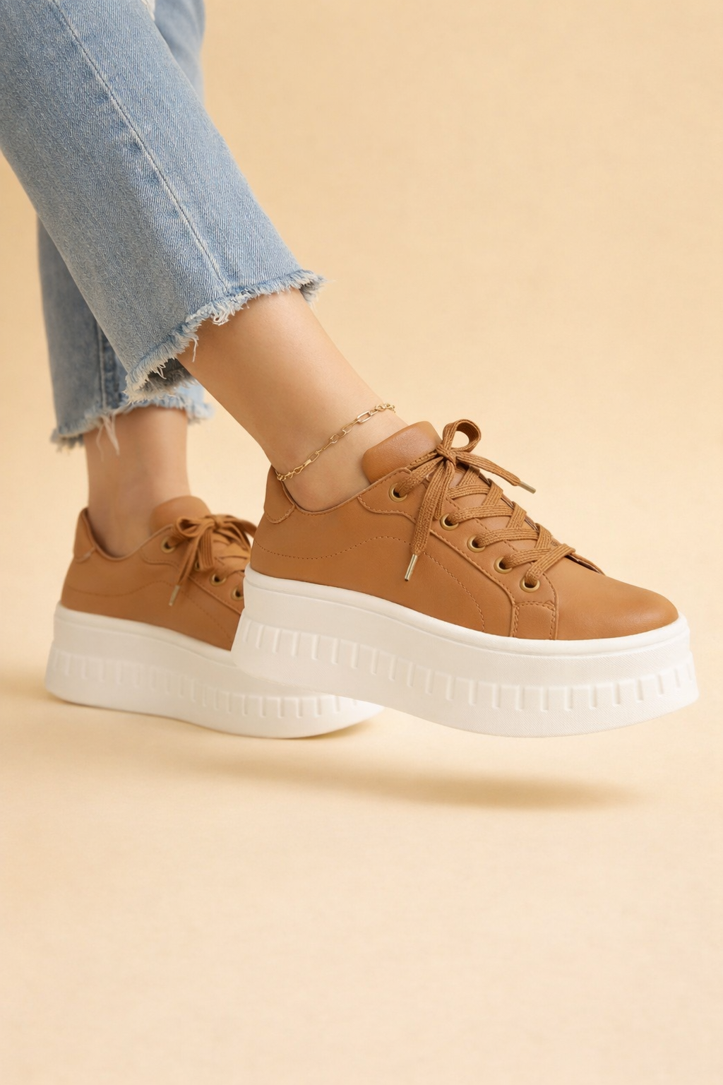 Women's platform sneakers with thick cushioned sole for comfortable all-day wear. Stylish and supportive.