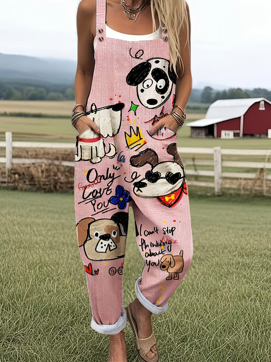 Woman in playful dog print wide-leg jumpsuit, adjustable straps. Perfect for casual summer fashion.