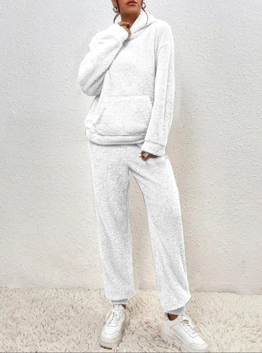 Women's relaxation outfit: two-piece plush loungewear set. Soft hoodie and pants, perfect for cozy winter essentials.