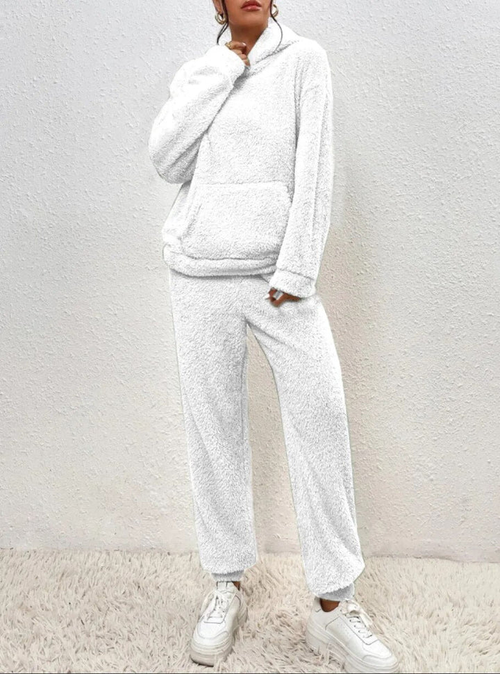 Women's relaxation outfit: two-piece plush loungewear set. Soft hoodie and pants, perfect for cozy winter essentials.