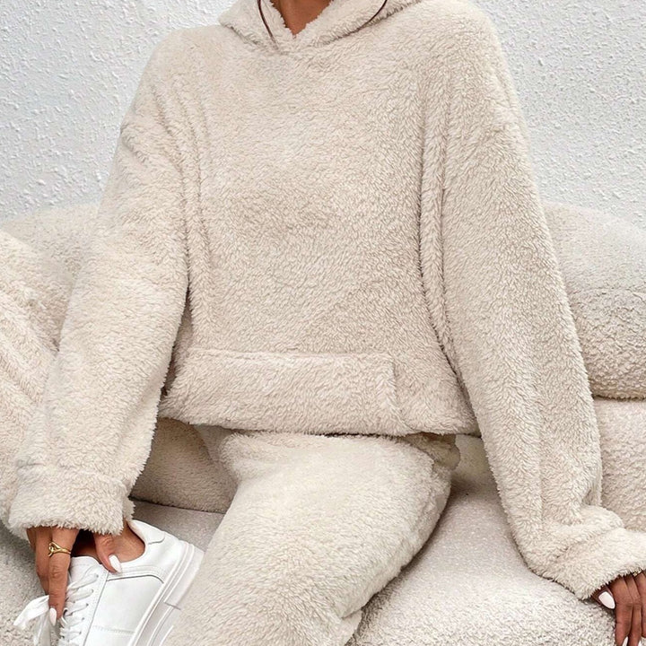 Soft women's loungewear set in plush fabric. Comfortable hoodie and pants, perfect for home attire & casual wear.