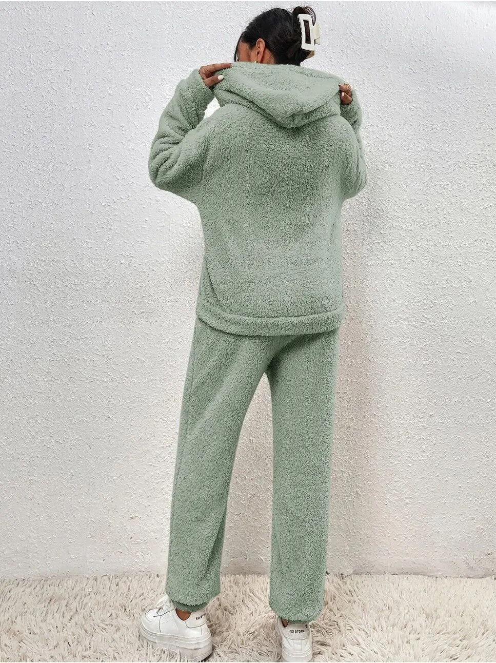 Two-piece women's loungewear: plush hoodie & matching pants. Soft, cozy set for fall and winter relaxation.