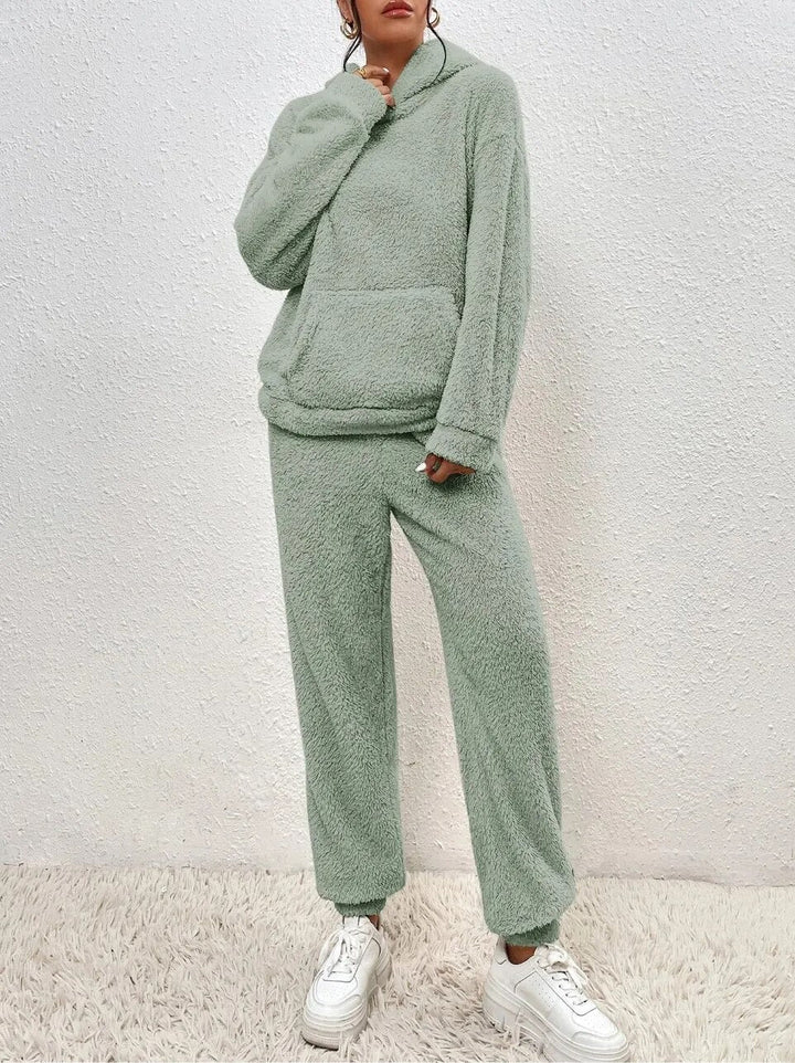 Detail shot of plush fabric on women's loungewear set. Ultimate comfort hoodie and pants for cozy wear.