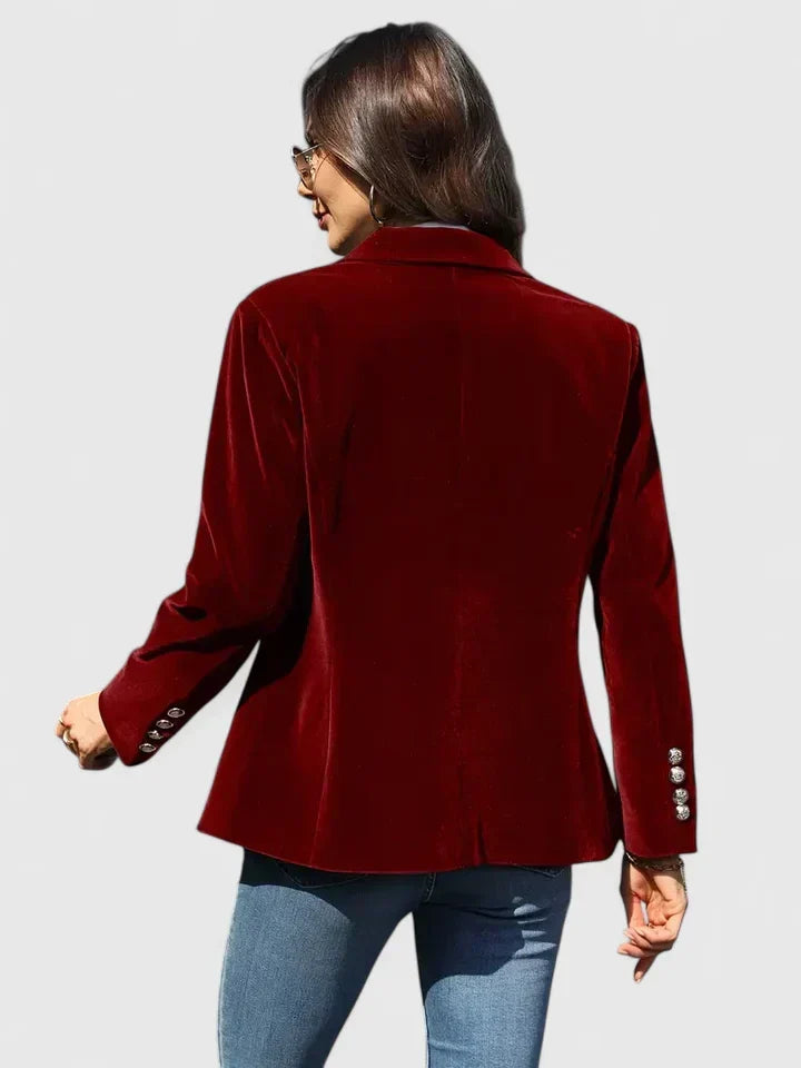 Versatile women's tailored blazer made from plush fabric, with a single-breasted style and striking gold buttons.