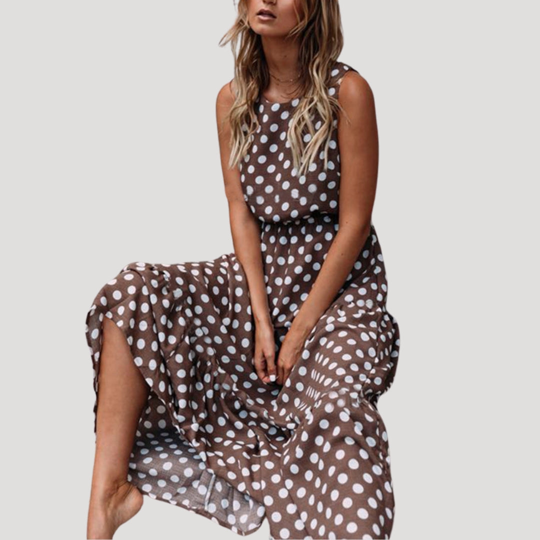 Women's polka dot sleeveless midi dress with a relaxed A-line fit, perfect for summer casual wear.