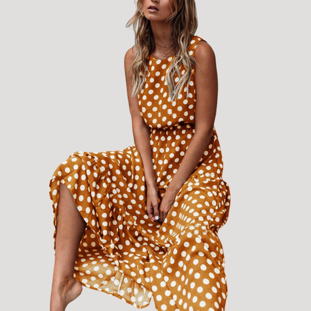 Relaxed fit women's sleeveless polka dot midi dress with a round neck and flowy A-line silhouette for summer comfort.