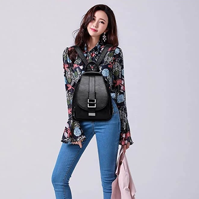 Functional women's water-resistant leather backpack, sleek design for daily errands.