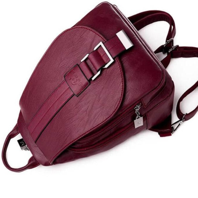 Premium black leather women's backpack, water-resistant, ideal for travel & work trips.