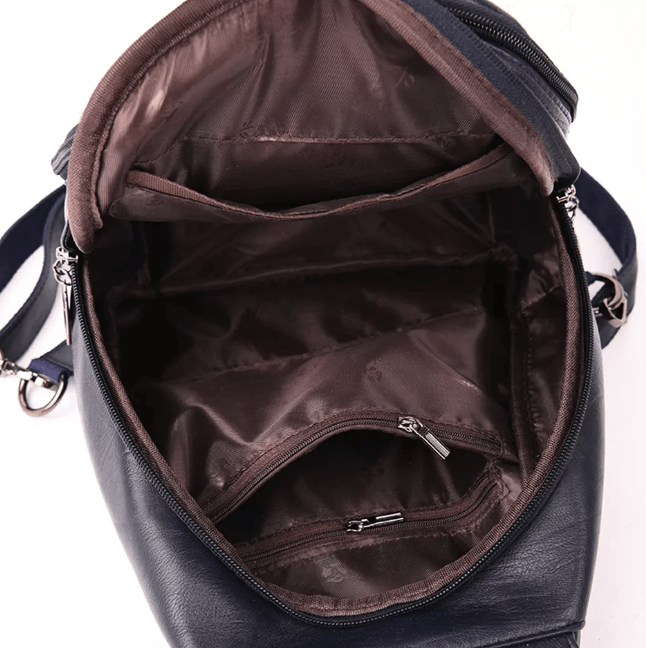 Functional women's premium leather backpack, water-resistant, great for city life.