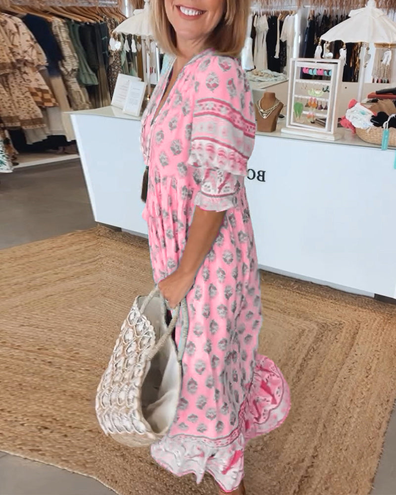 Elegant women's printed midi dress, bohemian-inspired, featuring beautiful lantern sleeves & soft fabric.