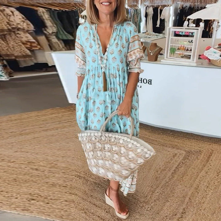 Women's printed bohemian midi dress, ideal for outdoor spring/summer events, with stylish lantern sleeves.