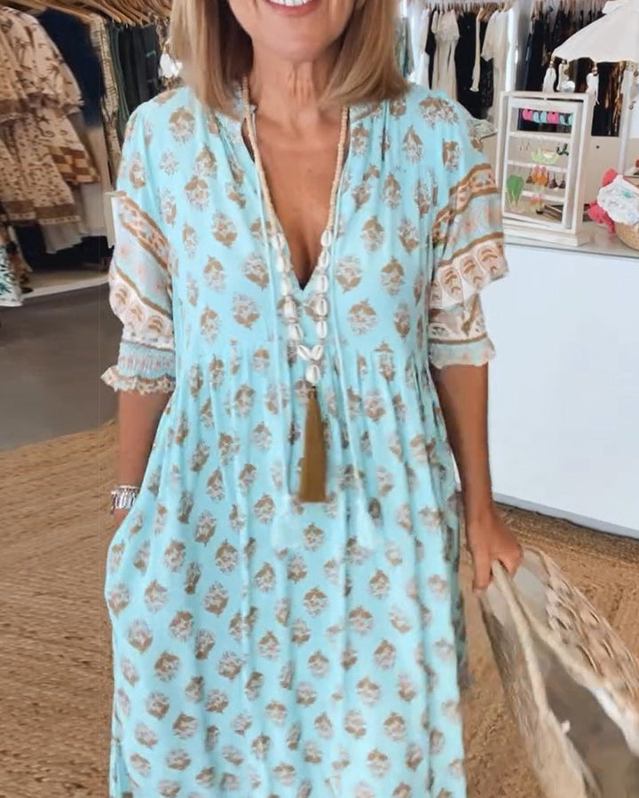 Casual summer printed midi dress for women with V-neck, stylish lantern sleeves, and loose fit.