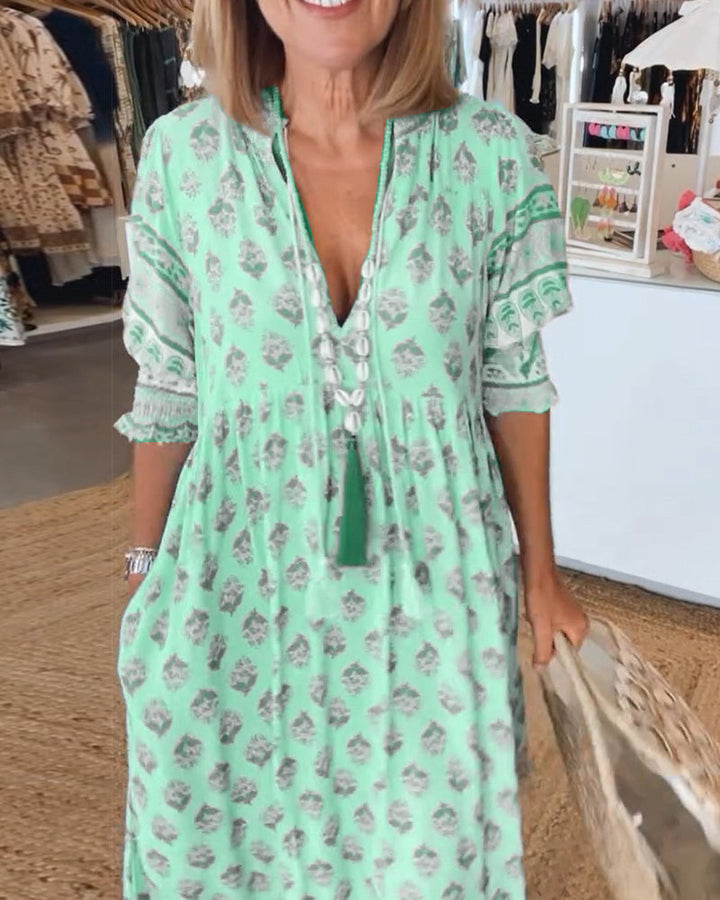 Women's boho printed midi dress, perfect for spring/summer, featuring comfortable lantern sleeves.
